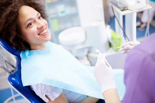 Female patient smiling before getting a dental exam at Timothy H. Kindt, DDS in Mesa, AZ 